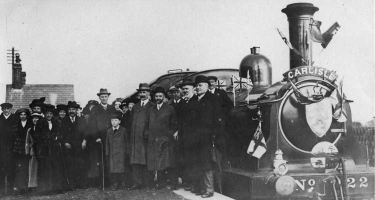 A crowd on the platform beside NBR 0-6-0T No 22 at Port Carlisle with the first train