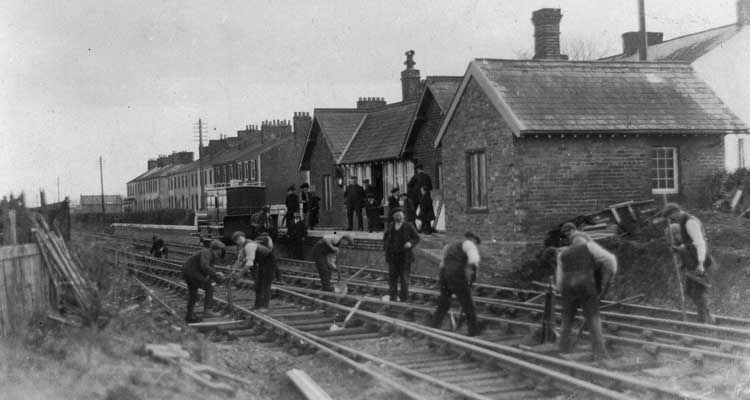 Men work on the track at Port Carlisle in preparation for steam trains that will replace the ‘Dandy’ in the picture
