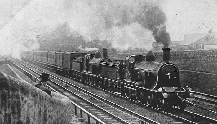 NBR No 598 4-4-0 on the Cowlairs Incline with an Edinburgh express, piloted by another 4-4-0 and with cable assistance